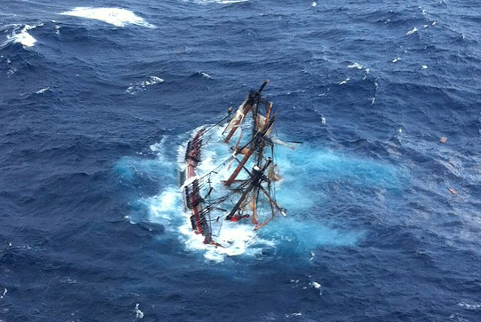US Coast Guard photo of the 1960 Bounty replica sinking during Hurricane Sandy in the Atlantic Ocean about 90 miles SE of Hatteras, North Carolina, after 16 crew members abandoned the sinking ship and were rescued by helicopter. Photo taken by USCG Photo by Petty Officer 2nd Class Tim Kuklewski on October 29, 2012.
