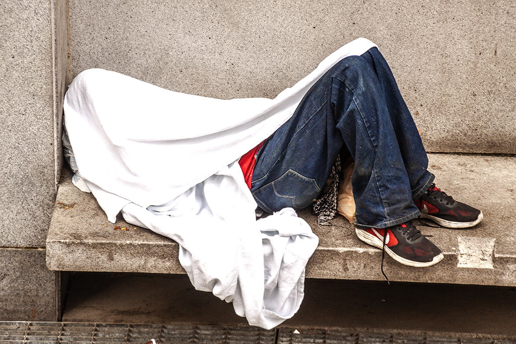 Homeless man in Thomas Paine Plaza--Center City