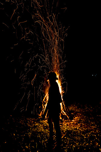 fire bonfire sparks trails night pyro pyrotechnics silhouette