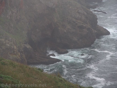 Waves swirl around the bottom of the cliffs at Point Reyes National Seashore, Calfornia