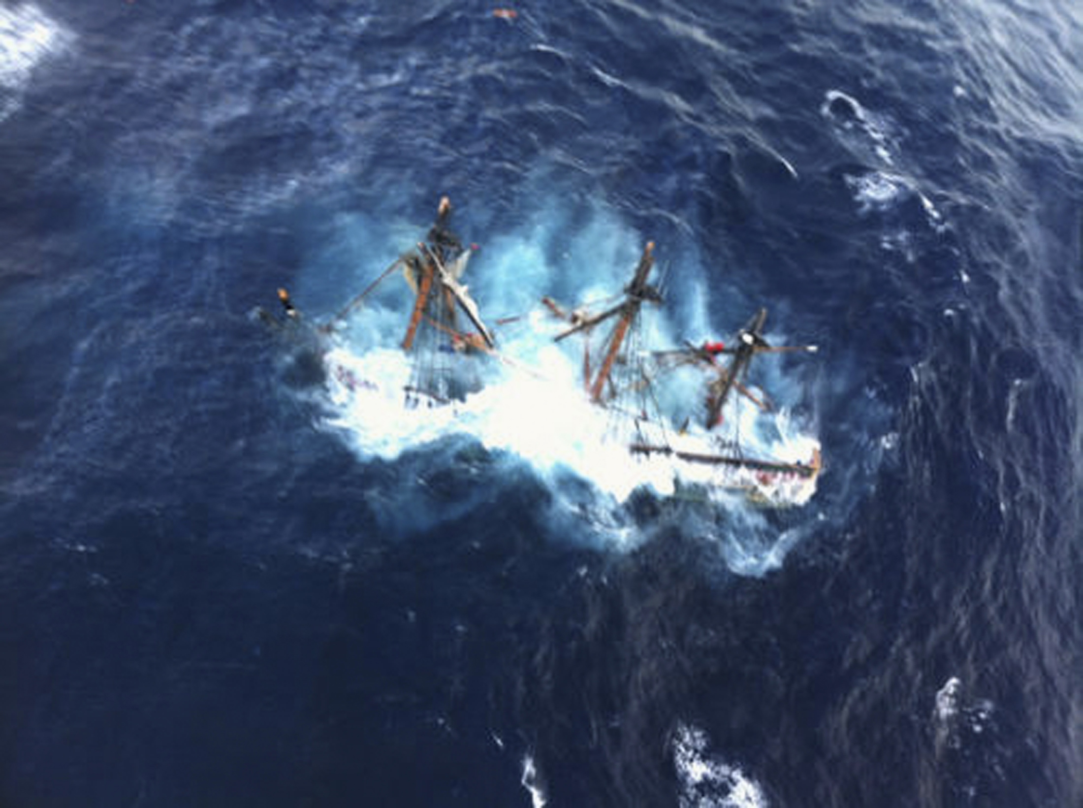 US Coast Guard photo of the 1960 Bounty replica sinking during Hurricane Sandy in the Atlantic Ocean about 90 miles SE of Hatteras, North Carolina, after 16 crew members abandoned the sinking ship and were rescued by helicopter. Photo taken by USCG Photo by Petty Officer 2nd Class Tim Kuklewski on October 29, 2012.