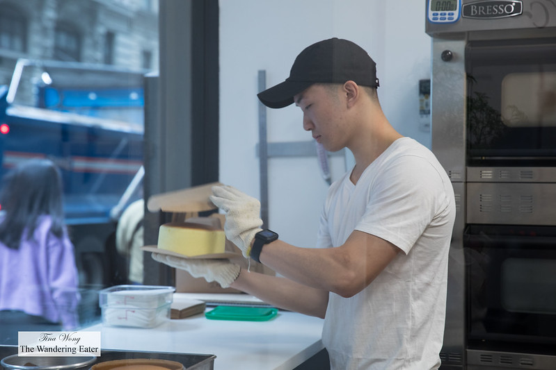 Employee flipping the piping hot Original Bouncy Cheesecake