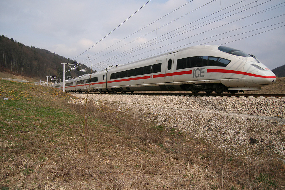 An ICE 3 (DB class 403) on the Nuremberg–Ingolstadt high-speed railway line, probably at 300 km/h. This train was headed for Munich, near the south entrance to the Euerwang-tunnel. Photo taken on March 31, 2007.