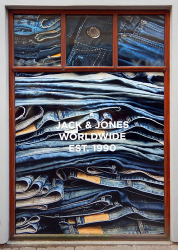 Store window with stacks of jeans in Aalborg, Denmark