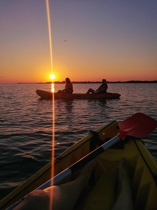Watching sunset from a kayak at sea