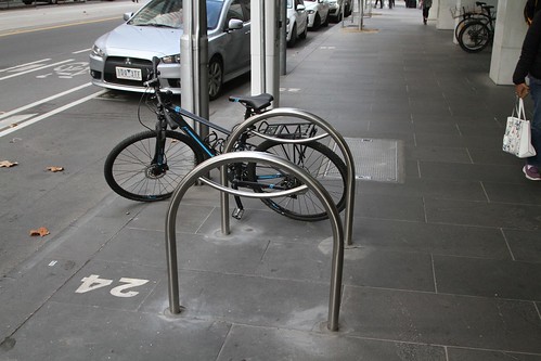 Bike racks running 90 degrees to the road and blocking the footpath at William and Bourke Street