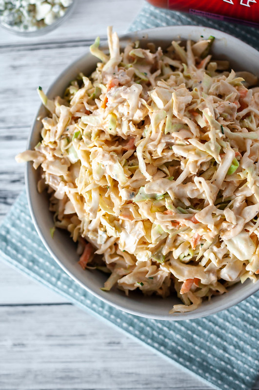 A classic American dish and a favorite flavor combine into one crazy delicious side dish. Buffalo Chicken Coleslaw is super creamy, slightly spicy and tangy and perfect for your next summer potluck.