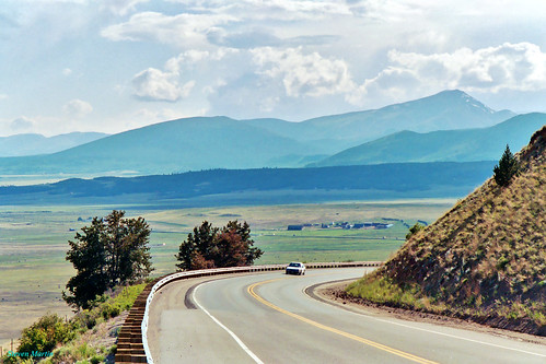 landscape scenery road plain mountains clouds colorado unitedstates