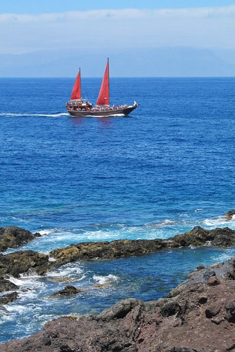 boat sailboat ocean tenerife canaryislands spain water rocks red blue travels horizon