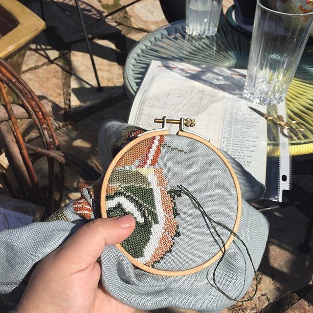 Getting in some outside stitchy time. Not pictured to my right is the massive stack of outside furniture. We wrestled out a couple of chairs and a small table which is enough of a start. #stitchingoutside #mothystitches