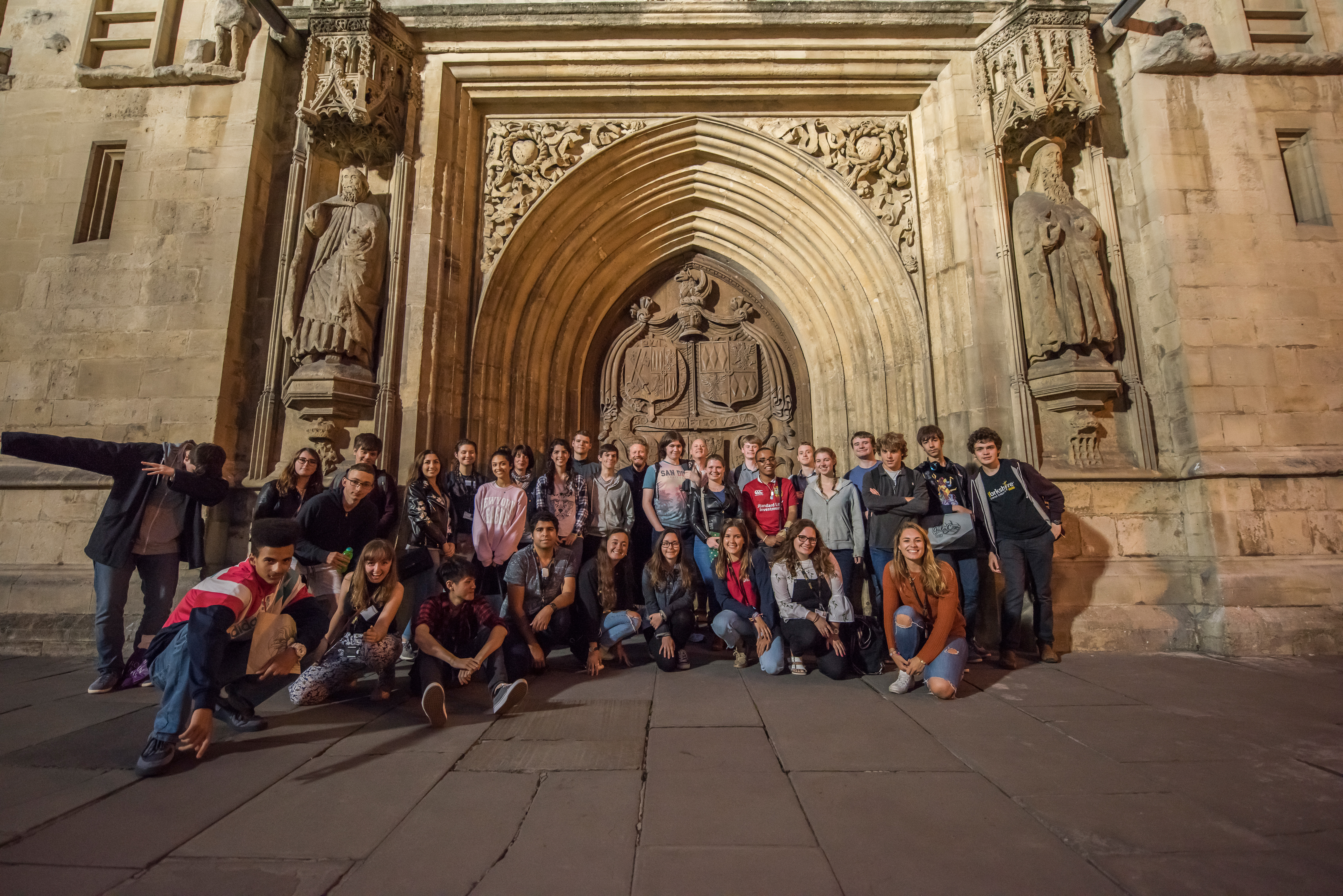 Students attending an autism summer school gather outside Bath Abbey doors