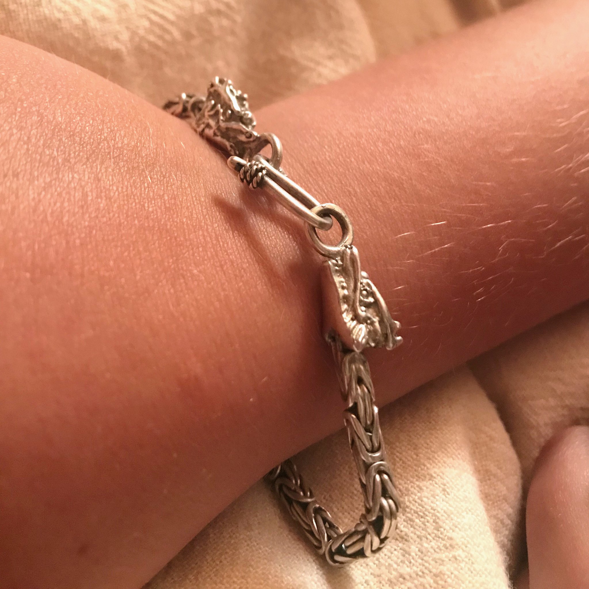 Casper's silver dragon bracelet