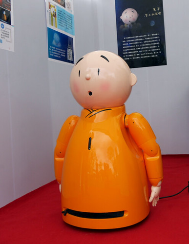 Xian'er is a 60-cm tall robot monk in yellow robes sporting a shaved head. From china.org.cn