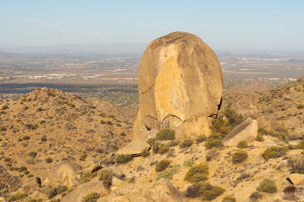 A large granite rock formation resembles an egg near the Tom's Thumb Trail in the McDowell Sonoran Preserve in Scottsdale, Arizona