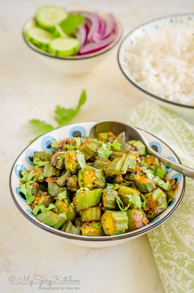 A bowl of Indian okra stir fry is an easy, everyday dry curry.  It is a great side dish for rice and flatbreads.