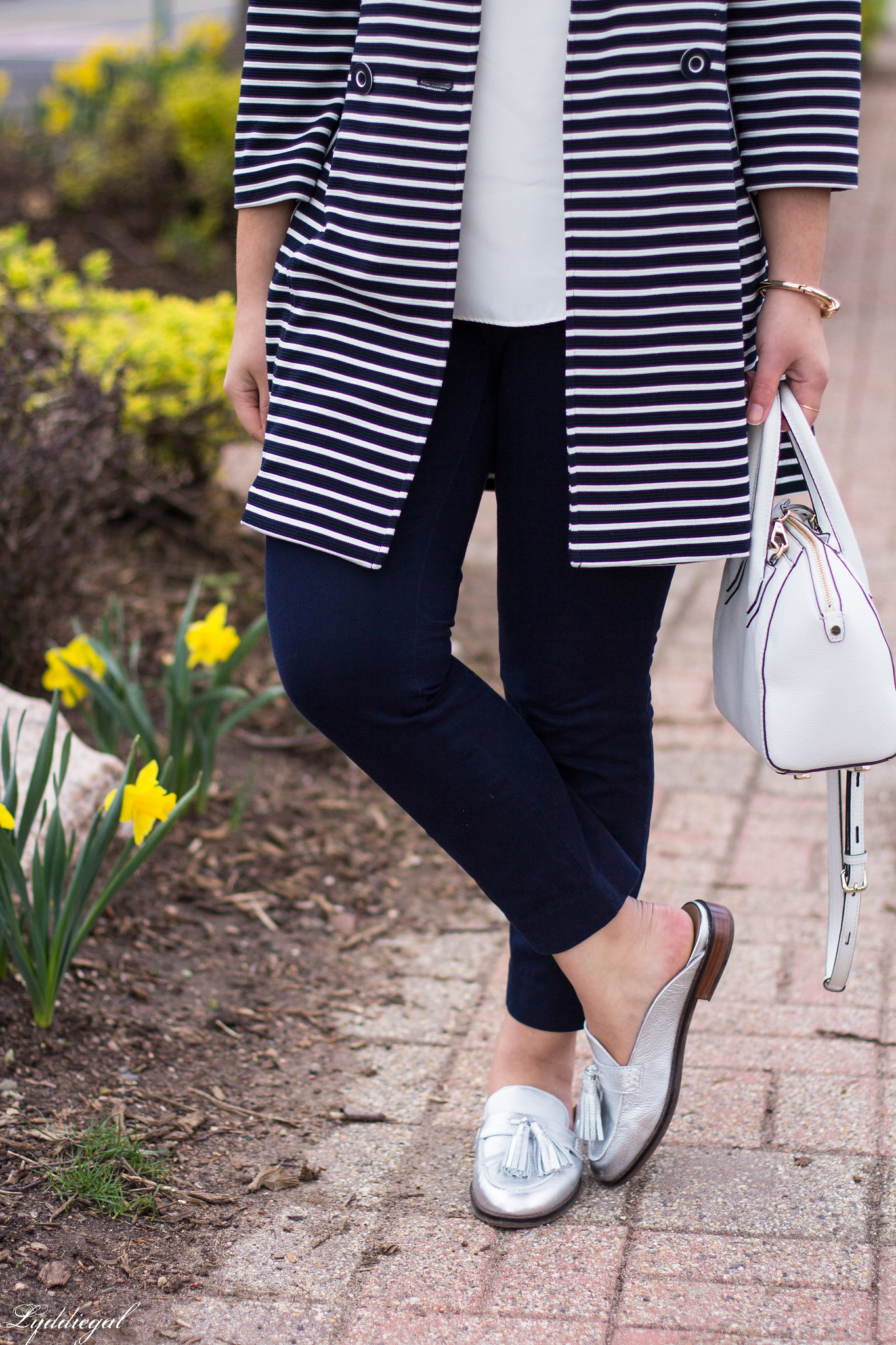 Striped trench, navy pants, silver 
loafers
