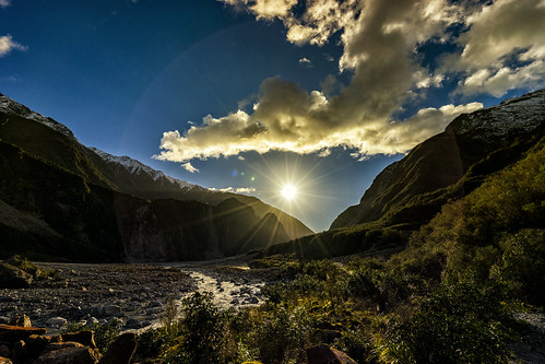 fox glacier nz new zealand sunset sun ray light landscape mountainside mountain river sky clouds outdoor travelling travelgram lonely planet natgeotravel bbctravel sony a7m2